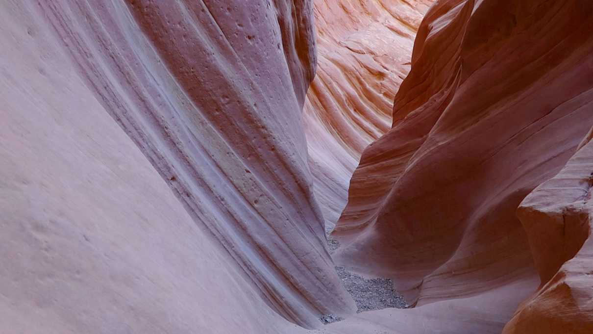 Narrow pink colored slot canyon walls