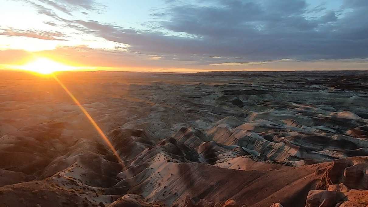 Striped hills with setting sun