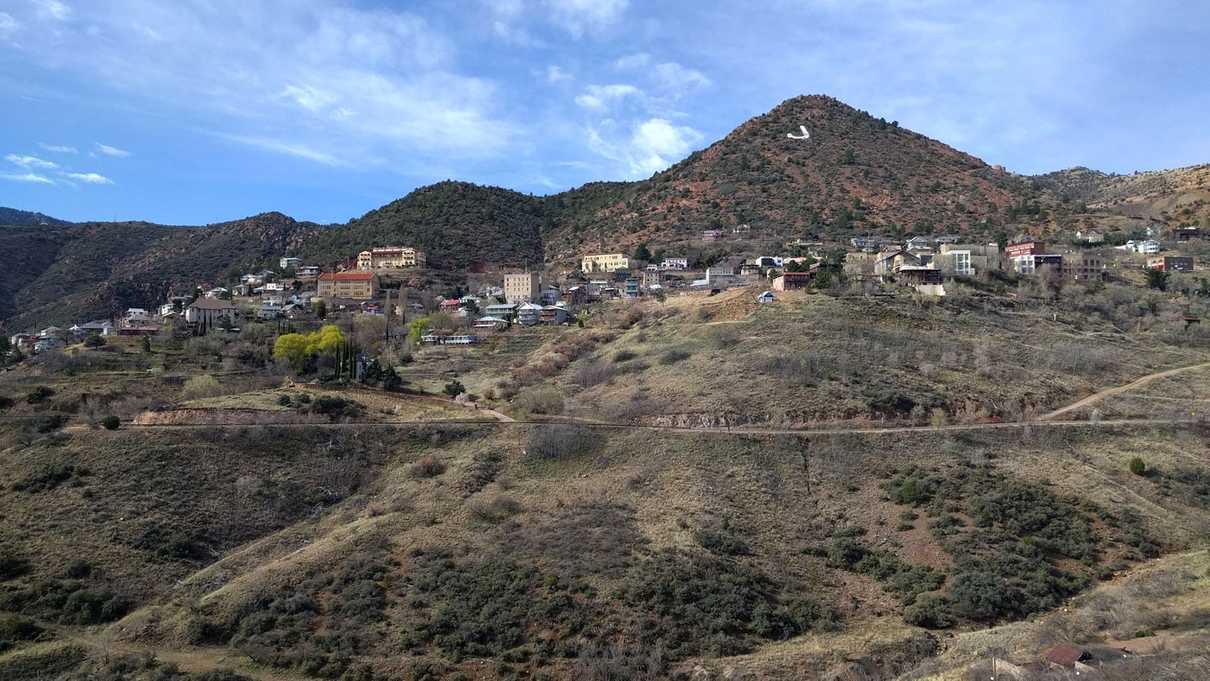 Distant view of Jerome buildings across a hillside