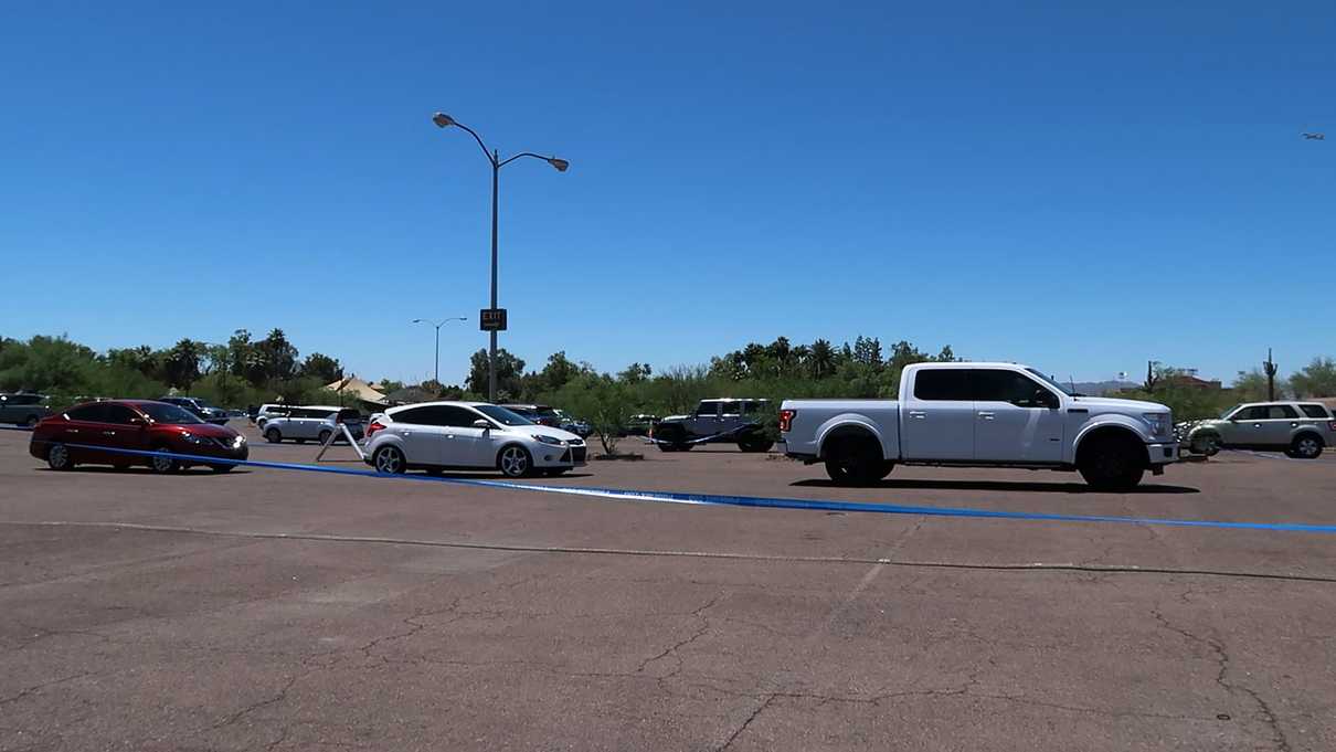 Cars in line in parking lot