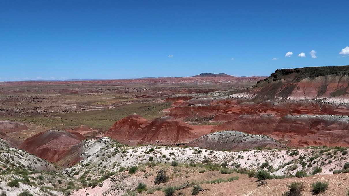 Striped hillsides rising from desert floor