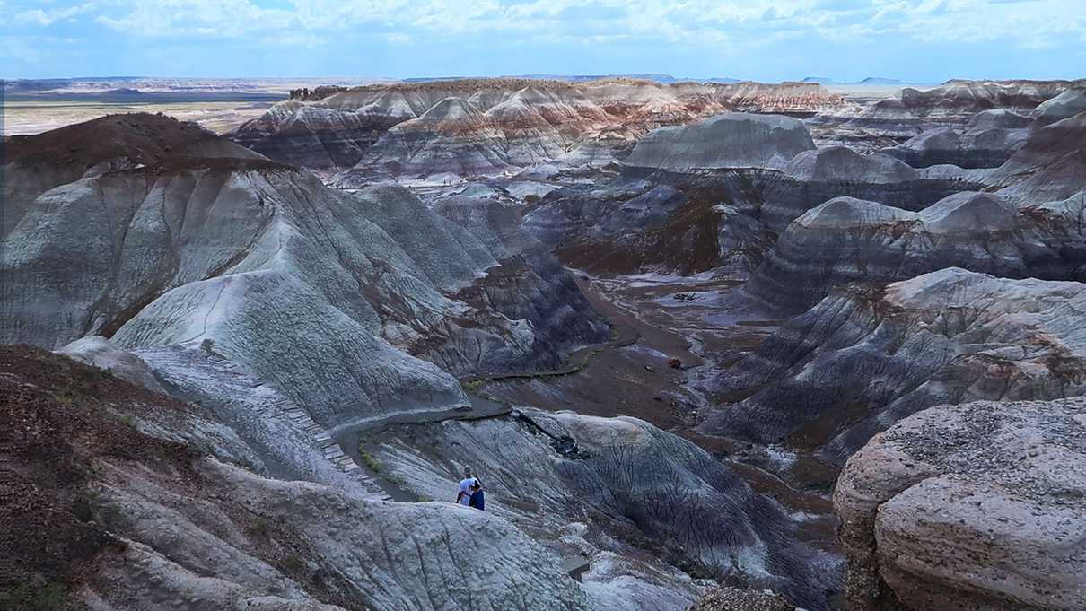 Valley of striped hills and trail leading down