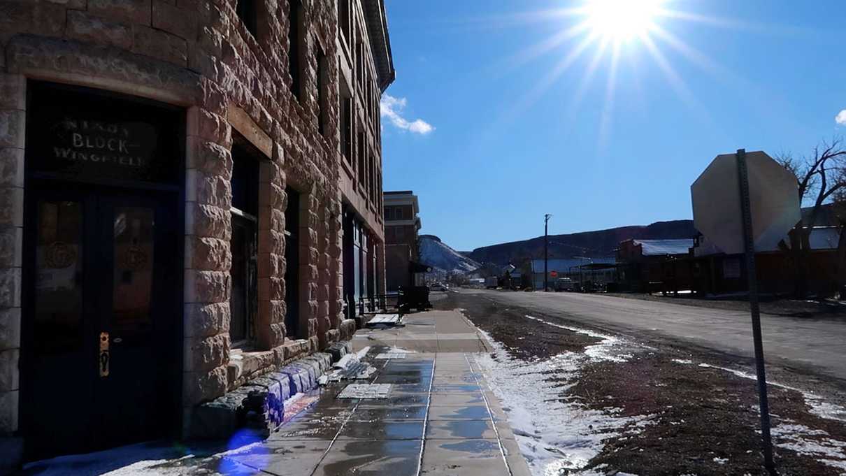 View down street of corner of Nixon Wingfield Block building