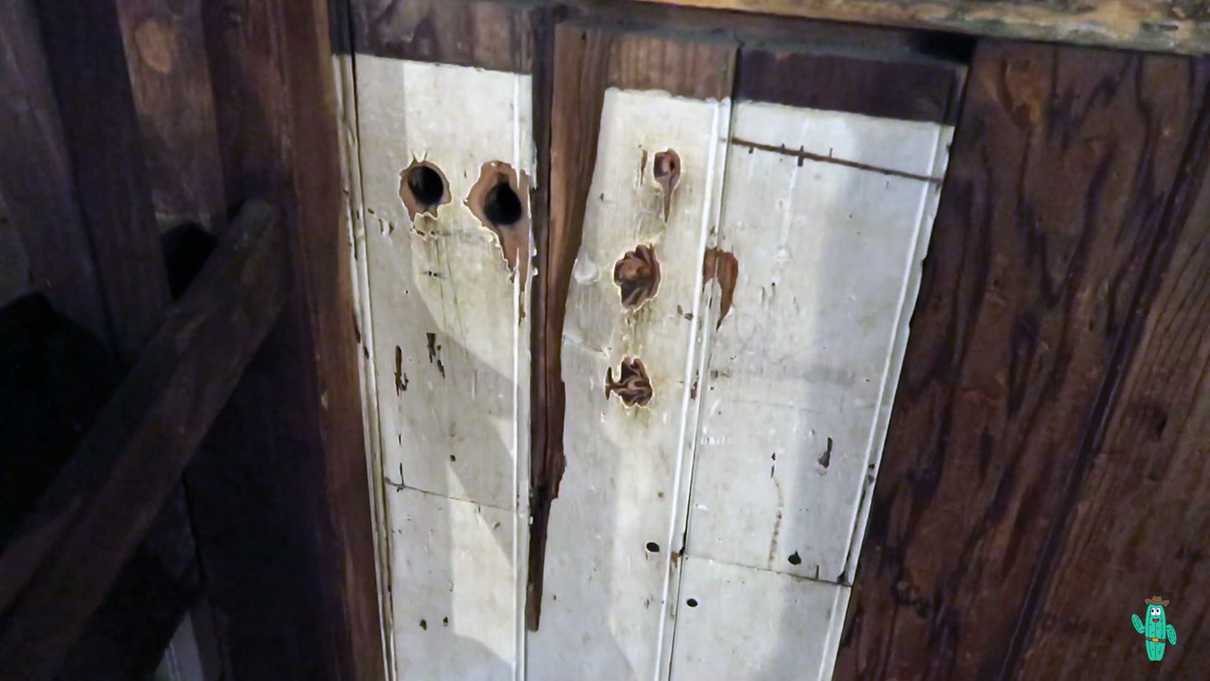 Bullet holes in the stage of the Bird Cage Theater