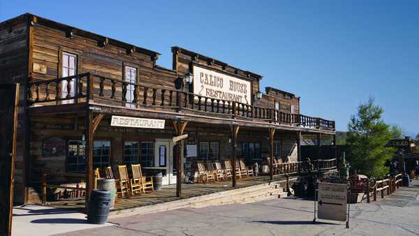 Wooden western style building with Calico House Restaurant sign