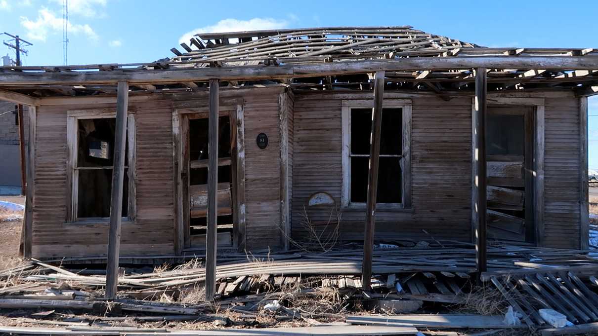 Crumbling remains of wooden home