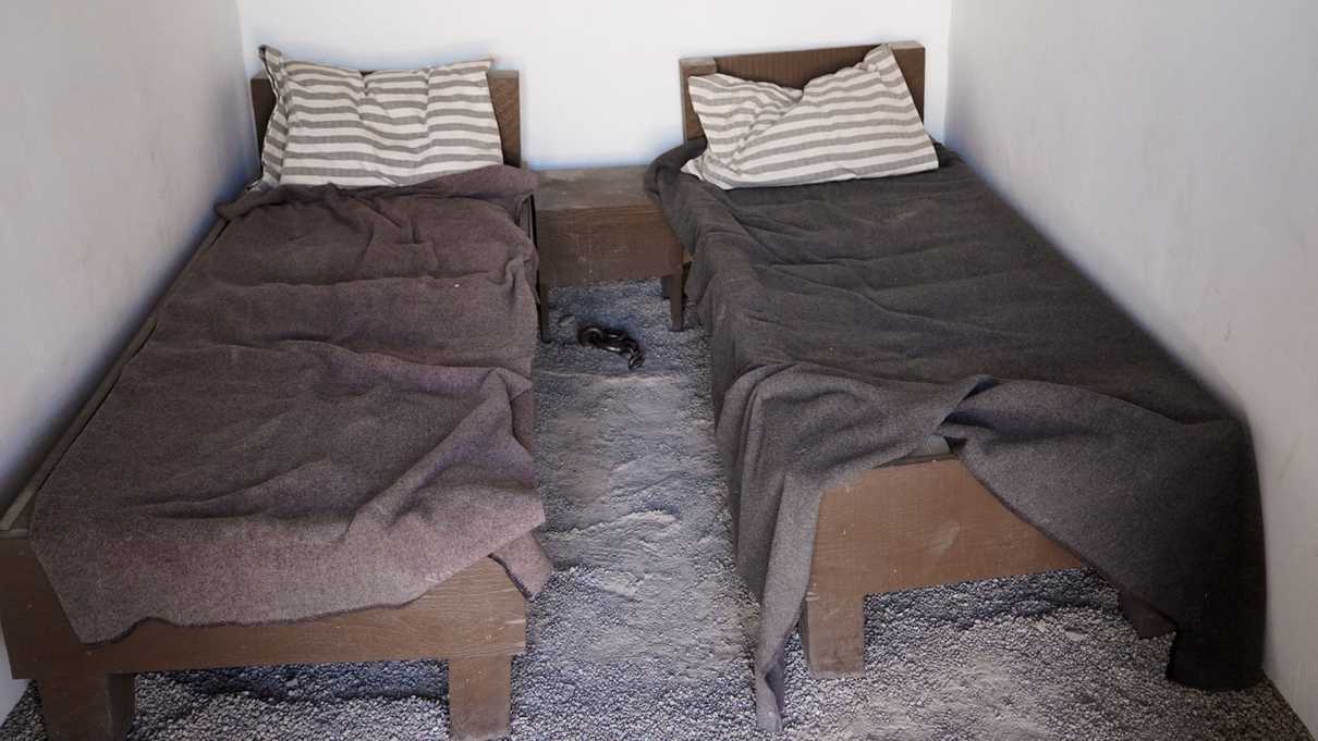 Two beds in small prison cell