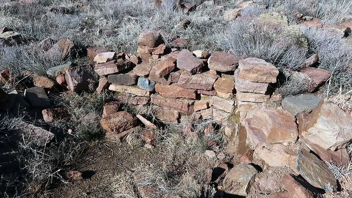 Low rock wall of Indian ruins