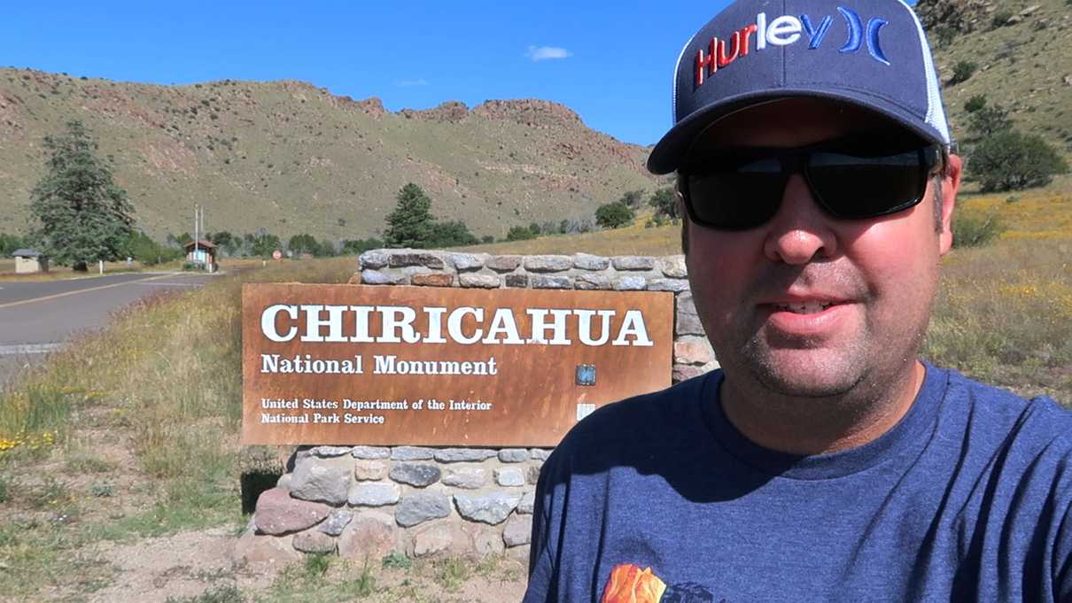 Standing in from of Chiricahua sign at Chiricahua National Monument