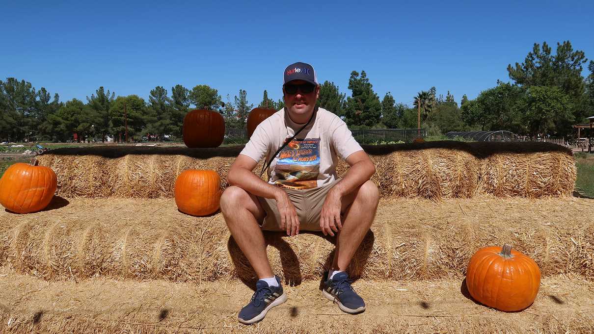 Sitting on bales of hay at Schnepf Farm