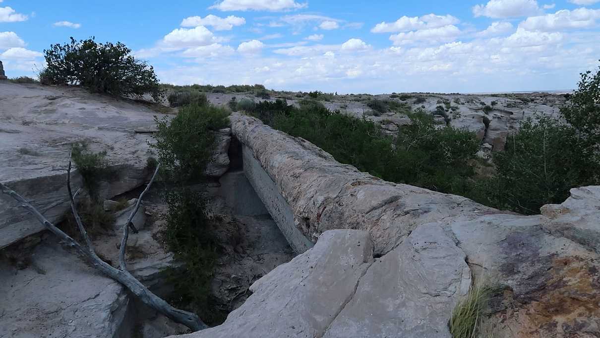 Petrified log spanning gap with a wash underneath