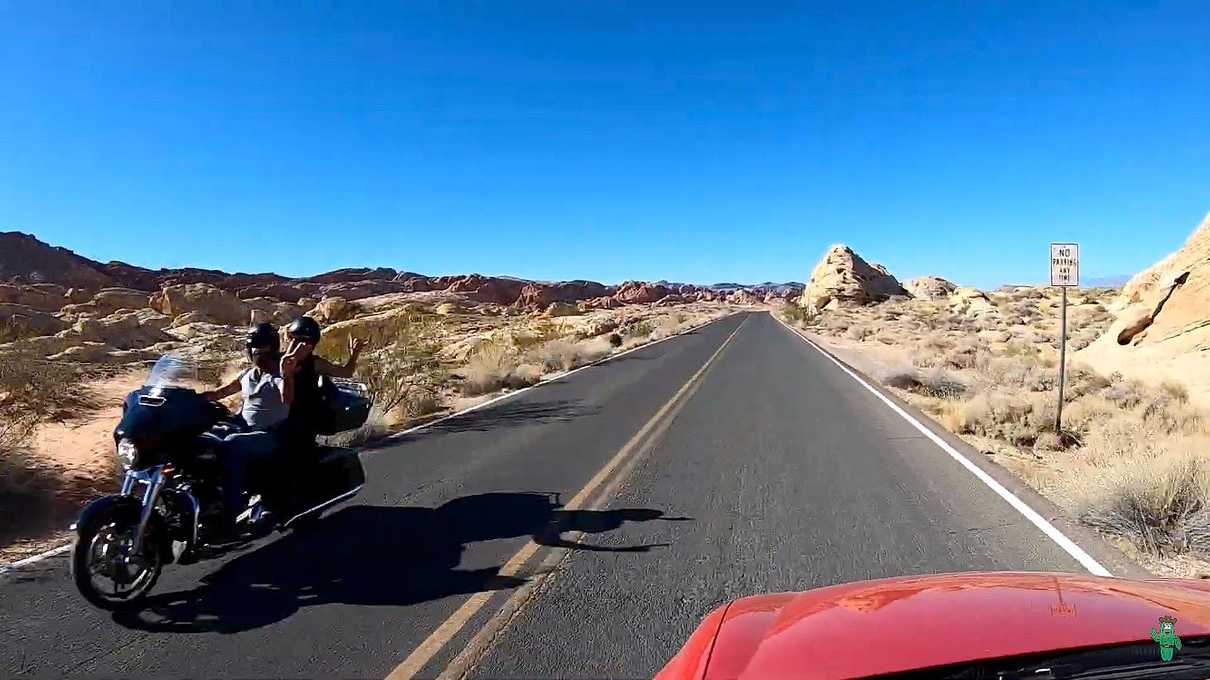 Motorcyclists flashing peace signs as I drive by them on White Domes Road